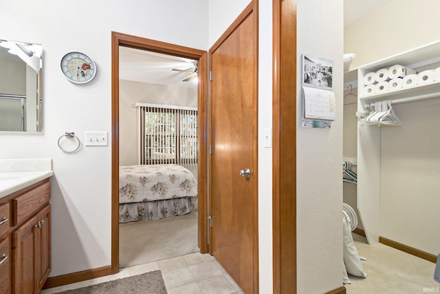 bathroom with tile patterned flooring and vanity