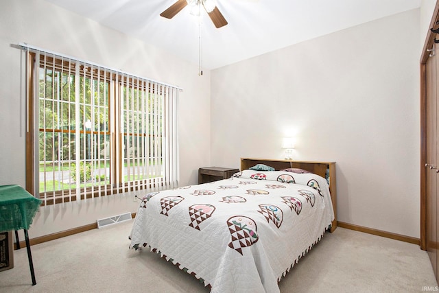 carpeted bedroom with ceiling fan