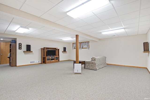 basement featuring carpet floors and a paneled ceiling