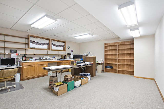 office area featuring light carpet and a drop ceiling