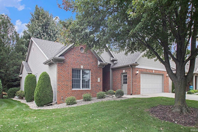 view of property with a front yard and a garage