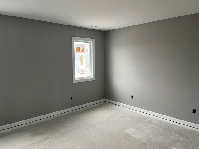 empty room with a textured ceiling