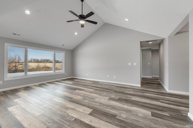 unfurnished living room with ceiling fan, high vaulted ceiling, and hardwood / wood-style flooring