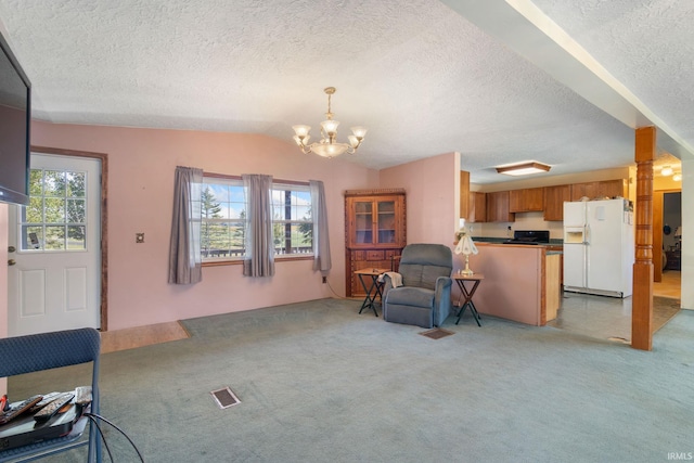 living area featuring vaulted ceiling, a textured ceiling, light colored carpet, and a chandelier