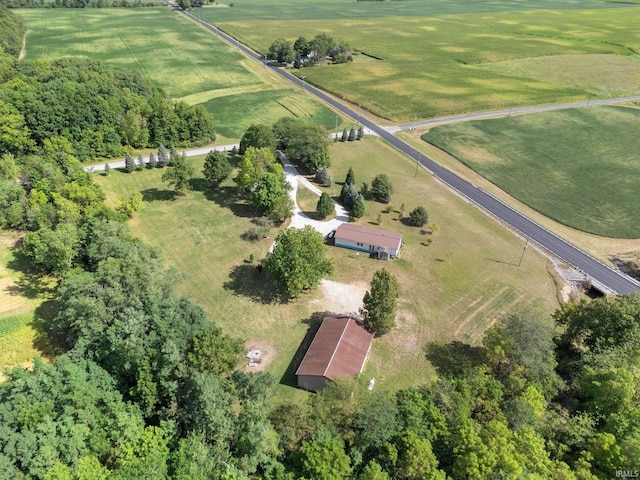 birds eye view of property with a rural view