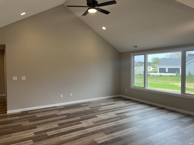 unfurnished room featuring dark wood-type flooring, high vaulted ceiling, and ceiling fan