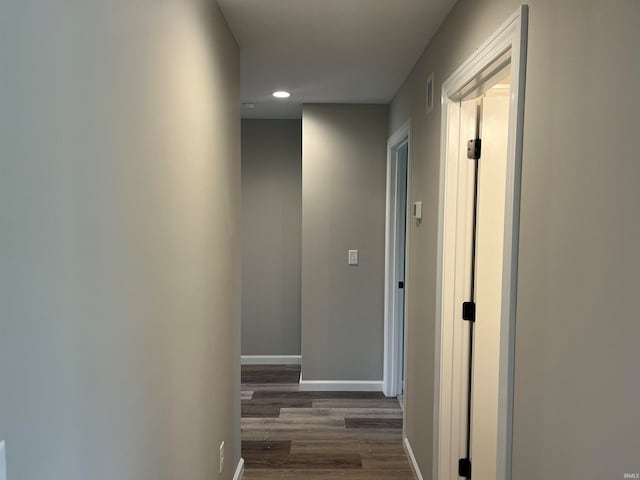 hall with dark hardwood / wood-style flooring