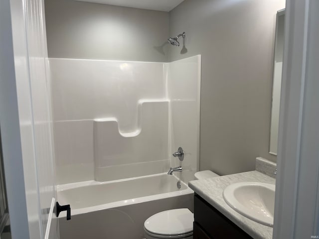 full bathroom featuring toilet, shower / washtub combination, and vanity