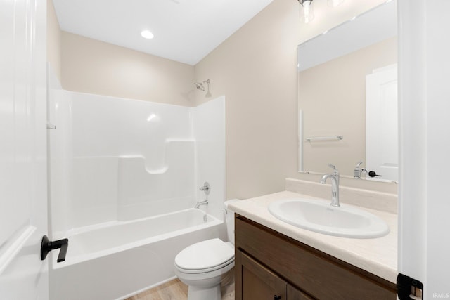 full bathroom featuring toilet, shower / bathing tub combination, and vanity