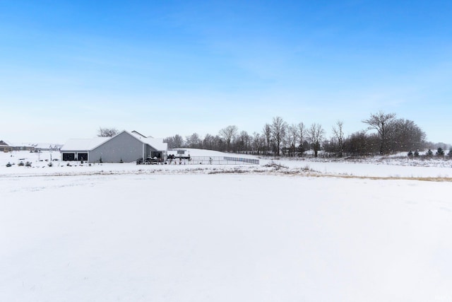 view of yard layered in snow