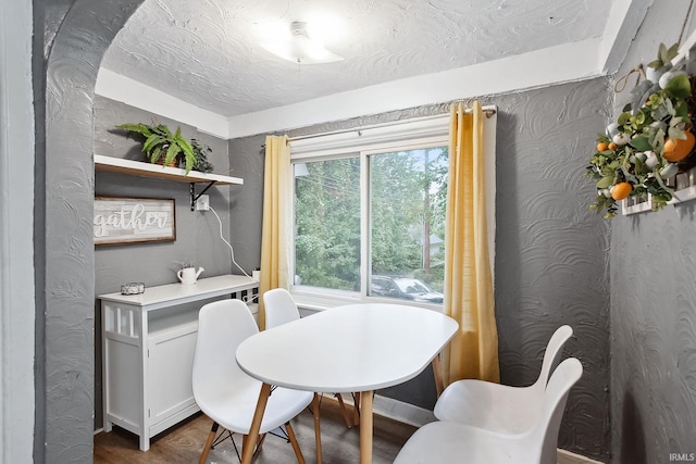 dining area with hardwood / wood-style flooring