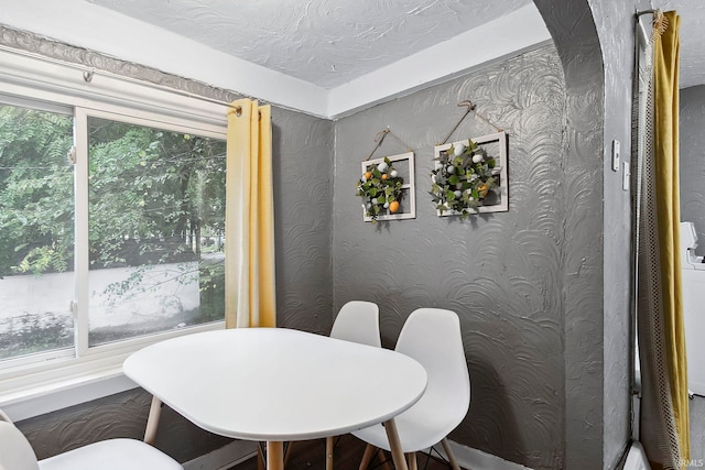 dining room with a textured ceiling