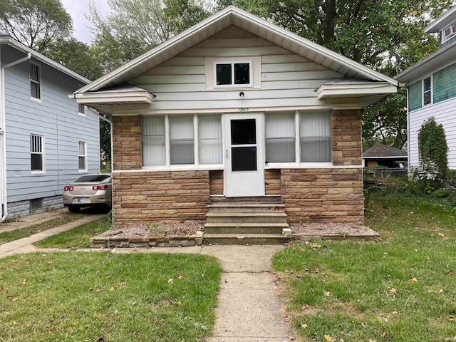 bungalow with a front yard