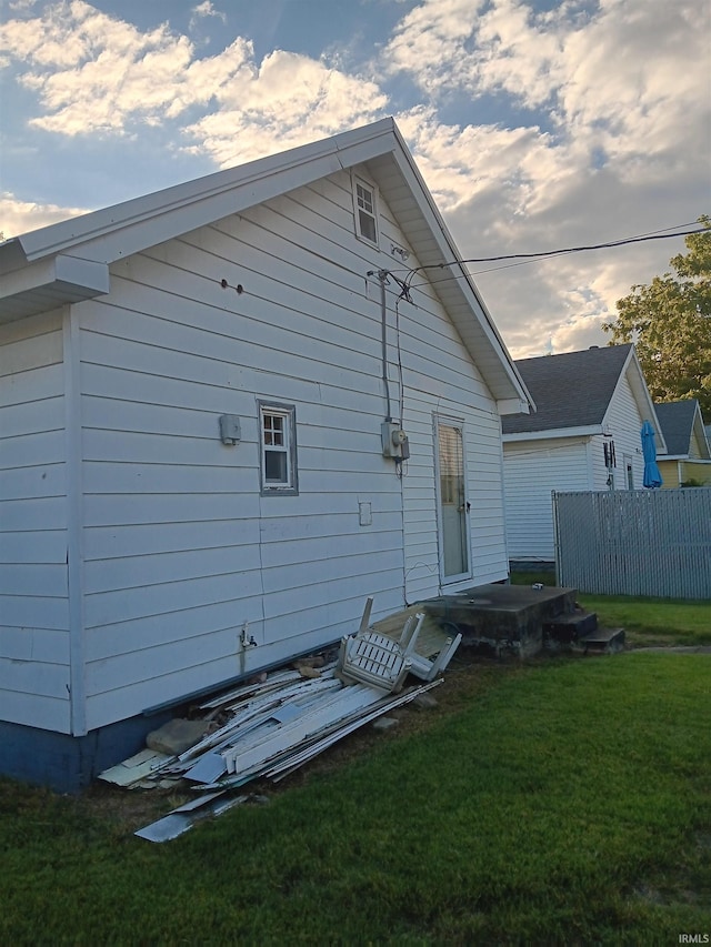 rear view of house with a yard