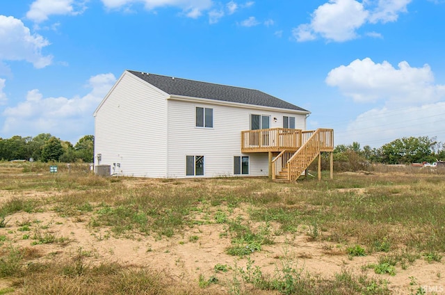 rear view of house featuring a deck