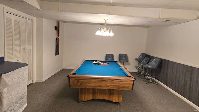 rec room with dark colored carpet, a drop ceiling, wooden walls, and pool table