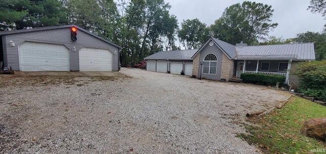 view of front facade featuring a porch and a garage