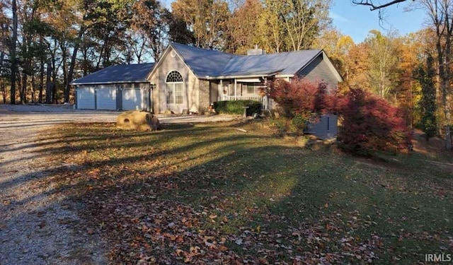 exterior space featuring a lawn and covered porch