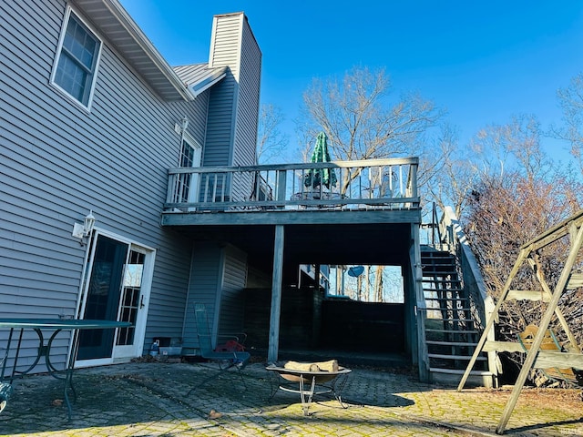 back of house with a patio and a wooden deck