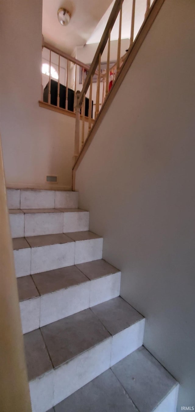 stairs with concrete floors