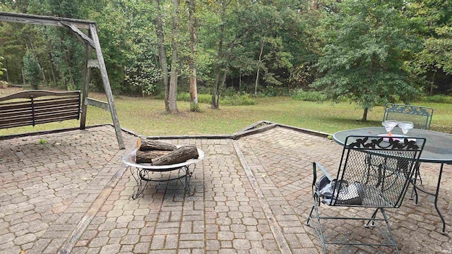 view of patio / terrace featuring a fire pit