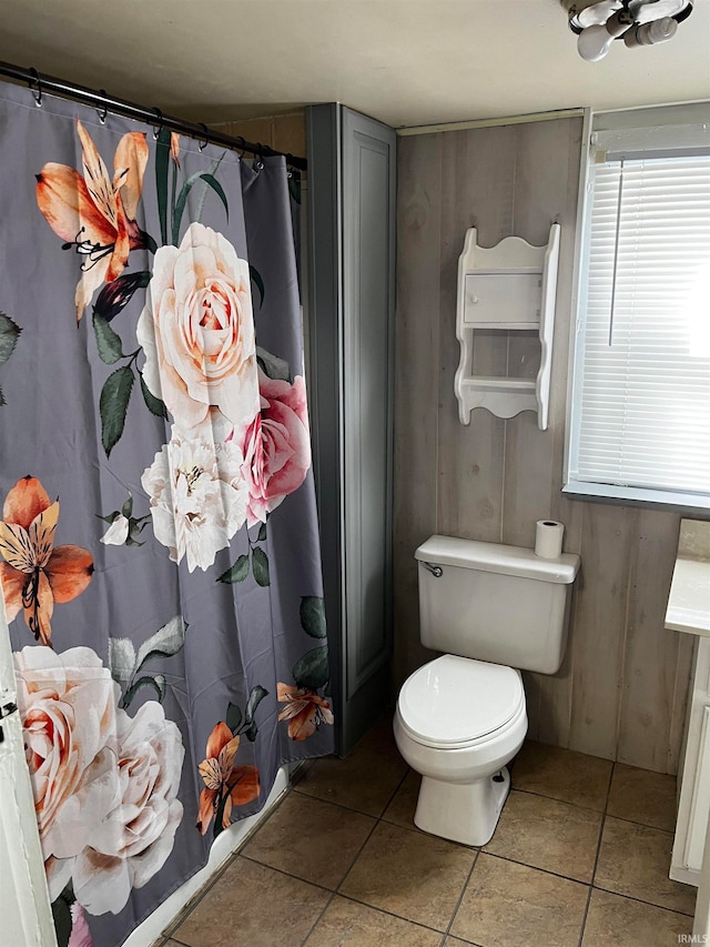 bathroom with tile patterned flooring and toilet