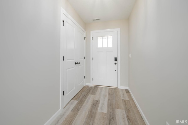 doorway to outside featuring light wood-type flooring