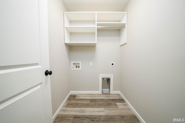 laundry area featuring washer hookup, light wood-type flooring, and hookup for an electric dryer