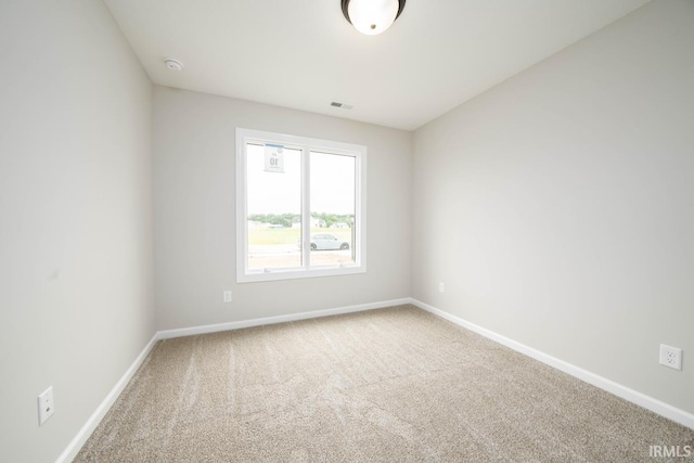 unfurnished room with carpet flooring