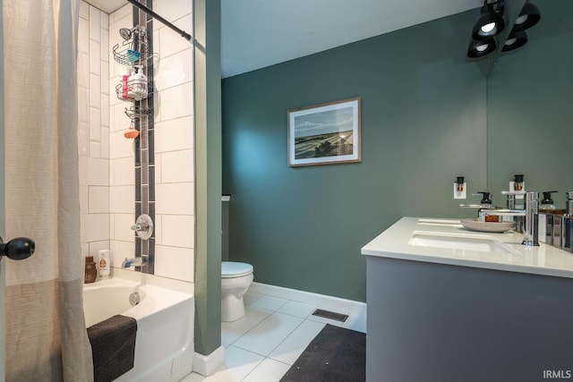 full bathroom with tile patterned flooring, independent shower and bath, vanity, and toilet