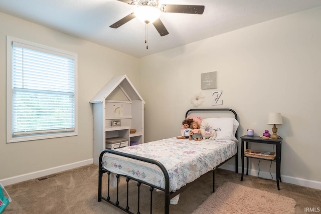 bedroom featuring ceiling fan and light carpet