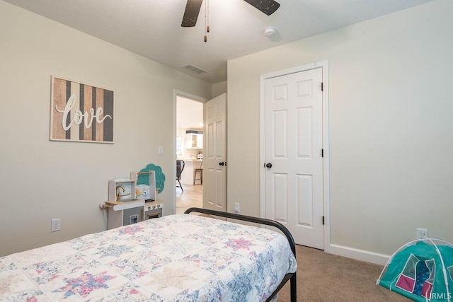 carpeted bedroom with ceiling fan