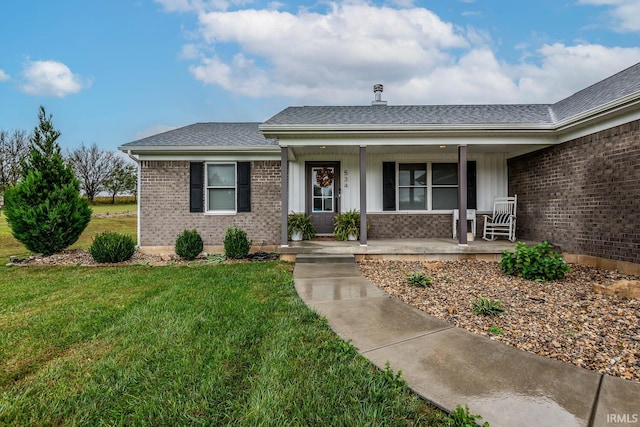 view of front of house featuring a front lawn and a porch