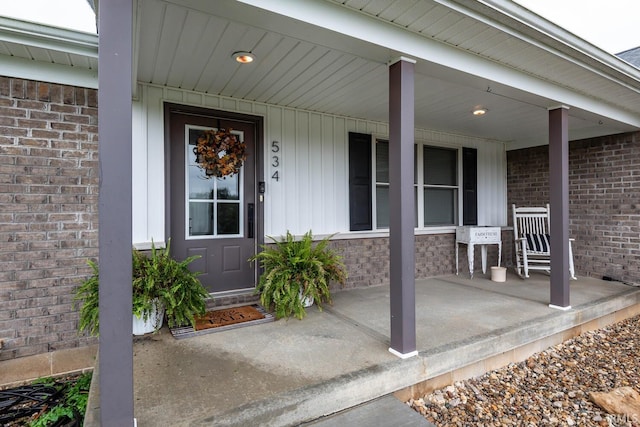 property entrance with covered porch