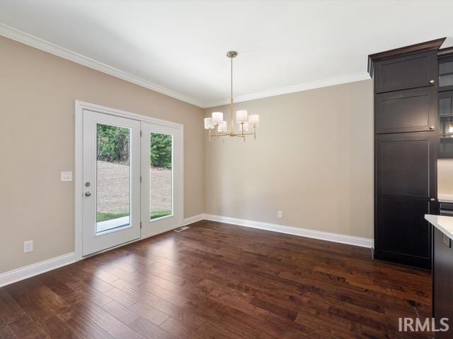 interior space with a notable chandelier, crown molding, and dark hardwood / wood-style flooring