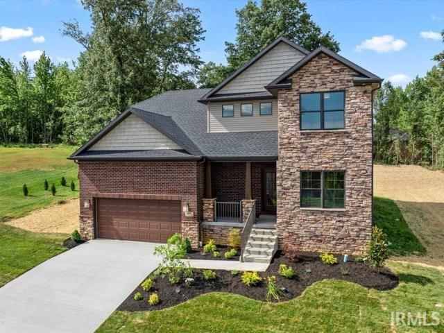 craftsman-style home with a front yard and a porch