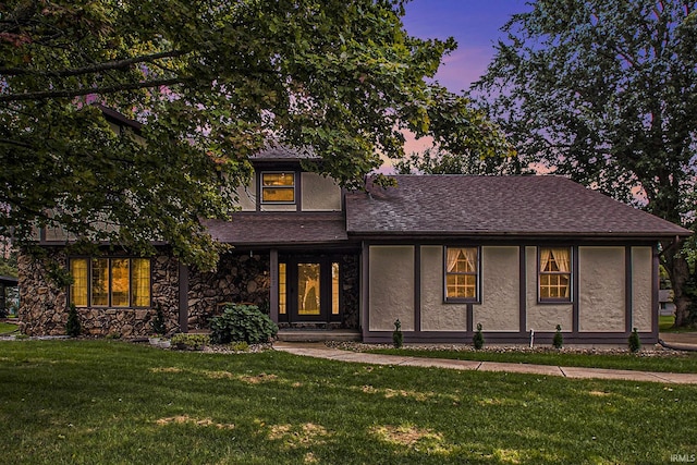 view of front of house with a yard