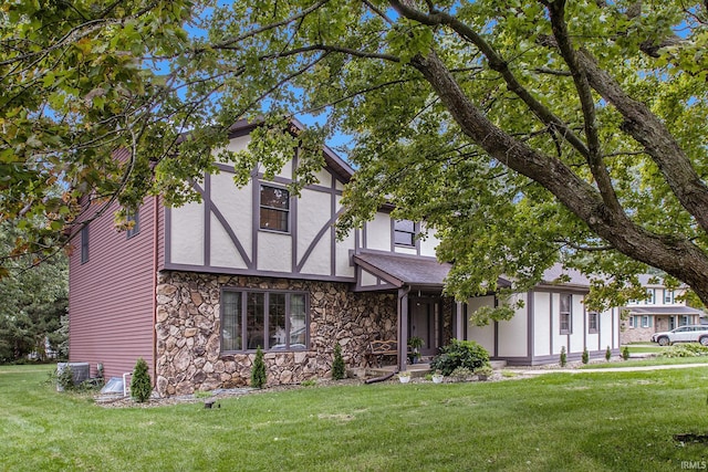 tudor home with a front yard