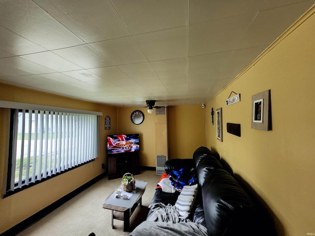 carpeted home theater room featuring baseboards