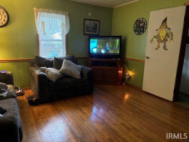 506 Meredith St, Washington, IN 47501 - living room with wood finished floors and ornamental molding