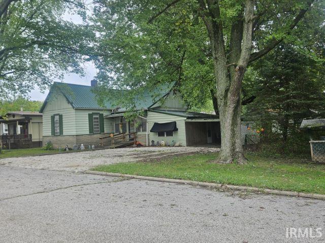 506 Meredith St, Washington, IN 47501 - view of front of property with a chimney and a metal roof