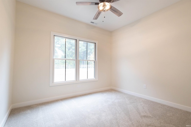 unfurnished room featuring carpet and ceiling fan