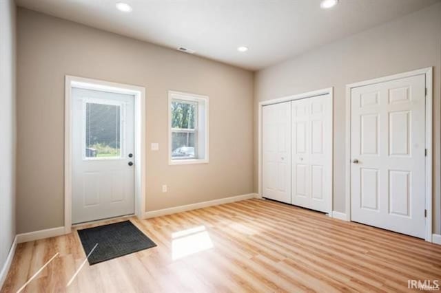 doorway to outside with light hardwood / wood-style floors