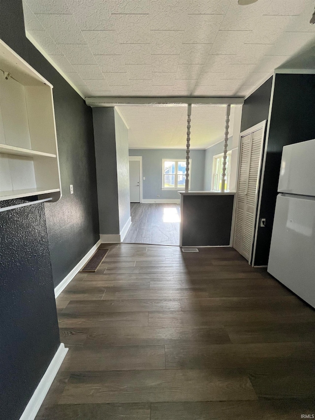 hallway with dark hardwood / wood-style floors