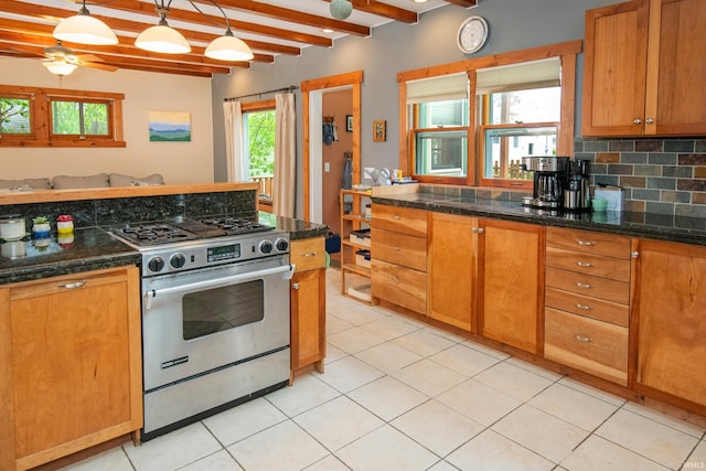 kitchen with high end stove, beamed ceiling, hanging light fixtures, and ceiling fan