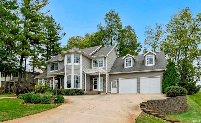 view of front facade featuring a garage and a front lawn