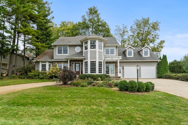 view of front facade featuring a garage and a front lawn