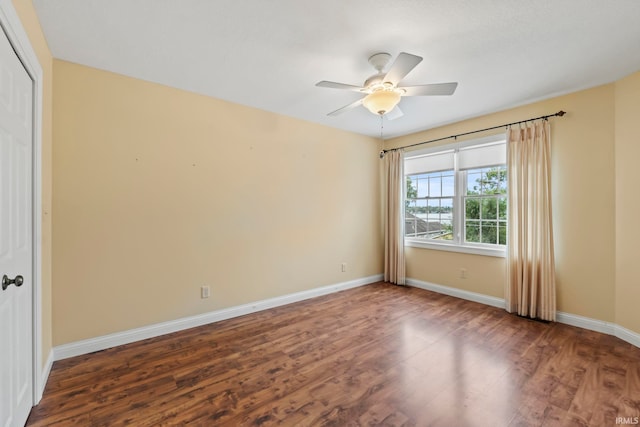 interior space with ceiling fan and dark hardwood / wood-style flooring