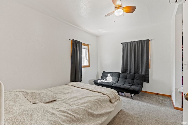 bedroom with ceiling fan and carpet