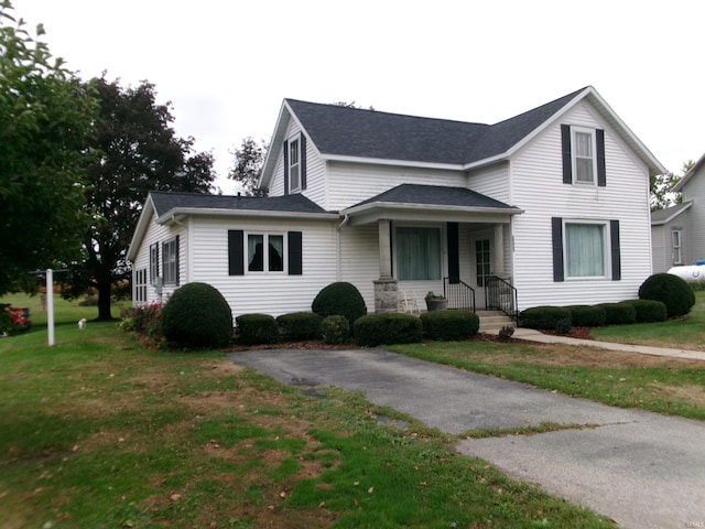 view of front of property with a front lawn and a porch